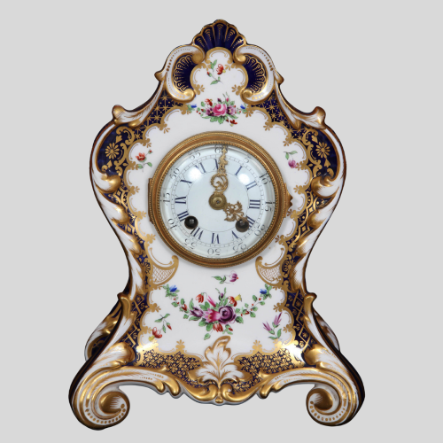 A0104 - Exquisitely embellished porcelain mantle clock